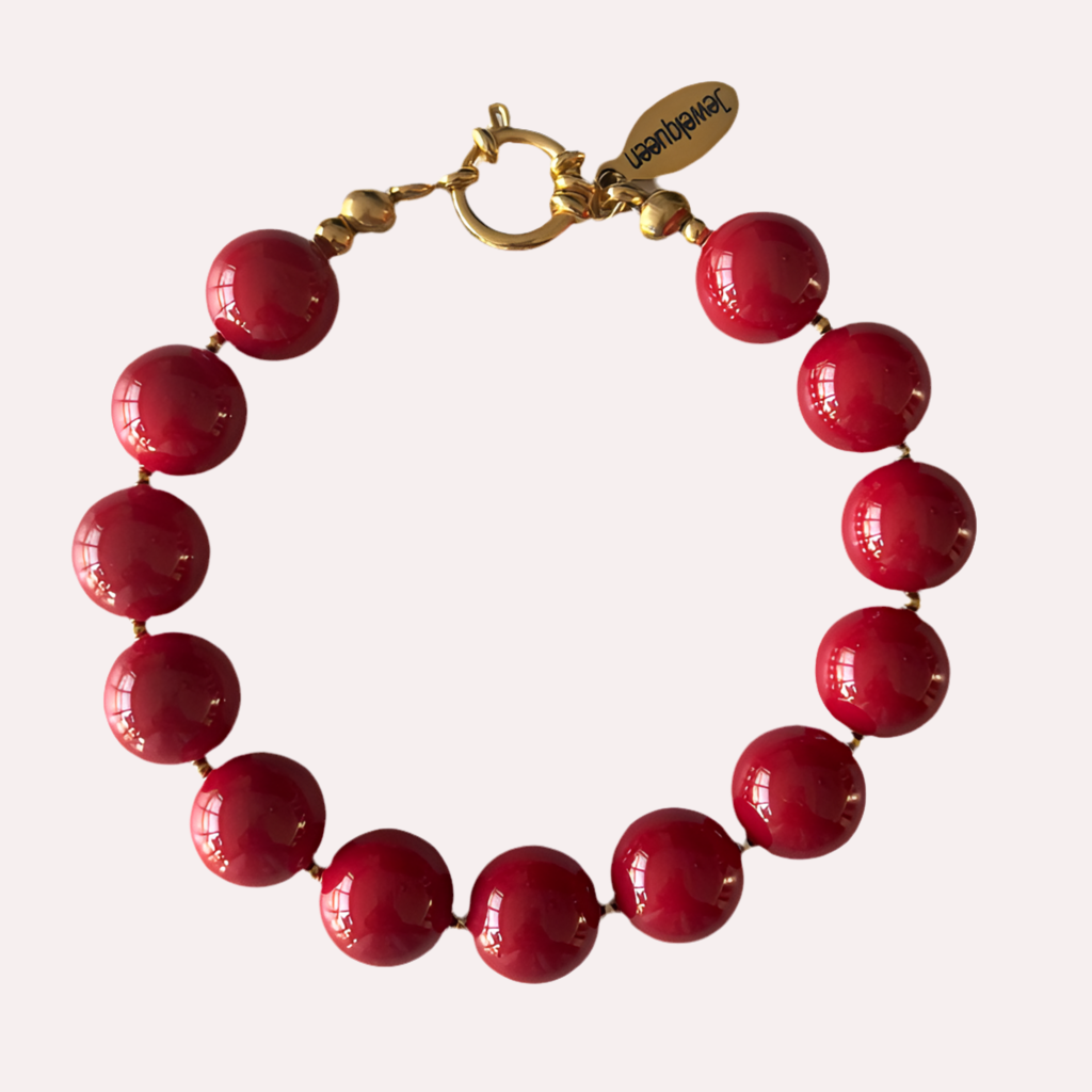 Gouden Stainless steel armband met rode kralen